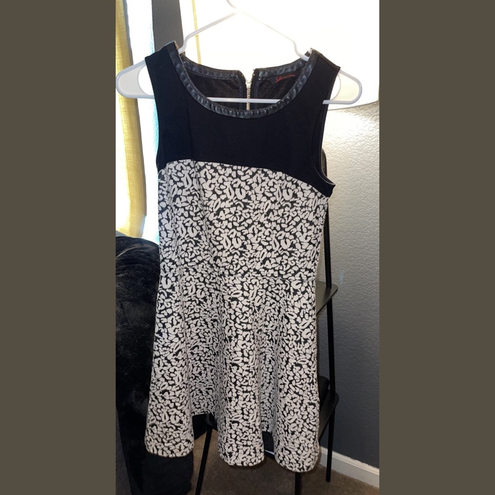 Zip up black dress with pattern. Flowy.